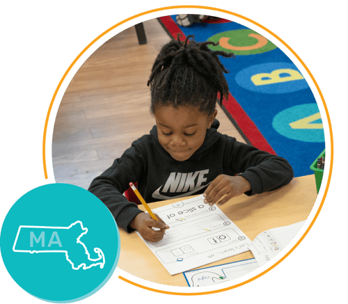 Massachusetts state and young girl working in literacy lesson Massachusetts state and young girl working in literacy lesson